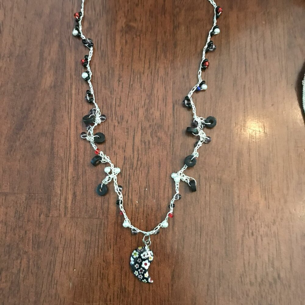 Black crescent pendant necklace